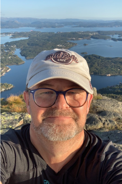 man in caps lakes and islands in background
